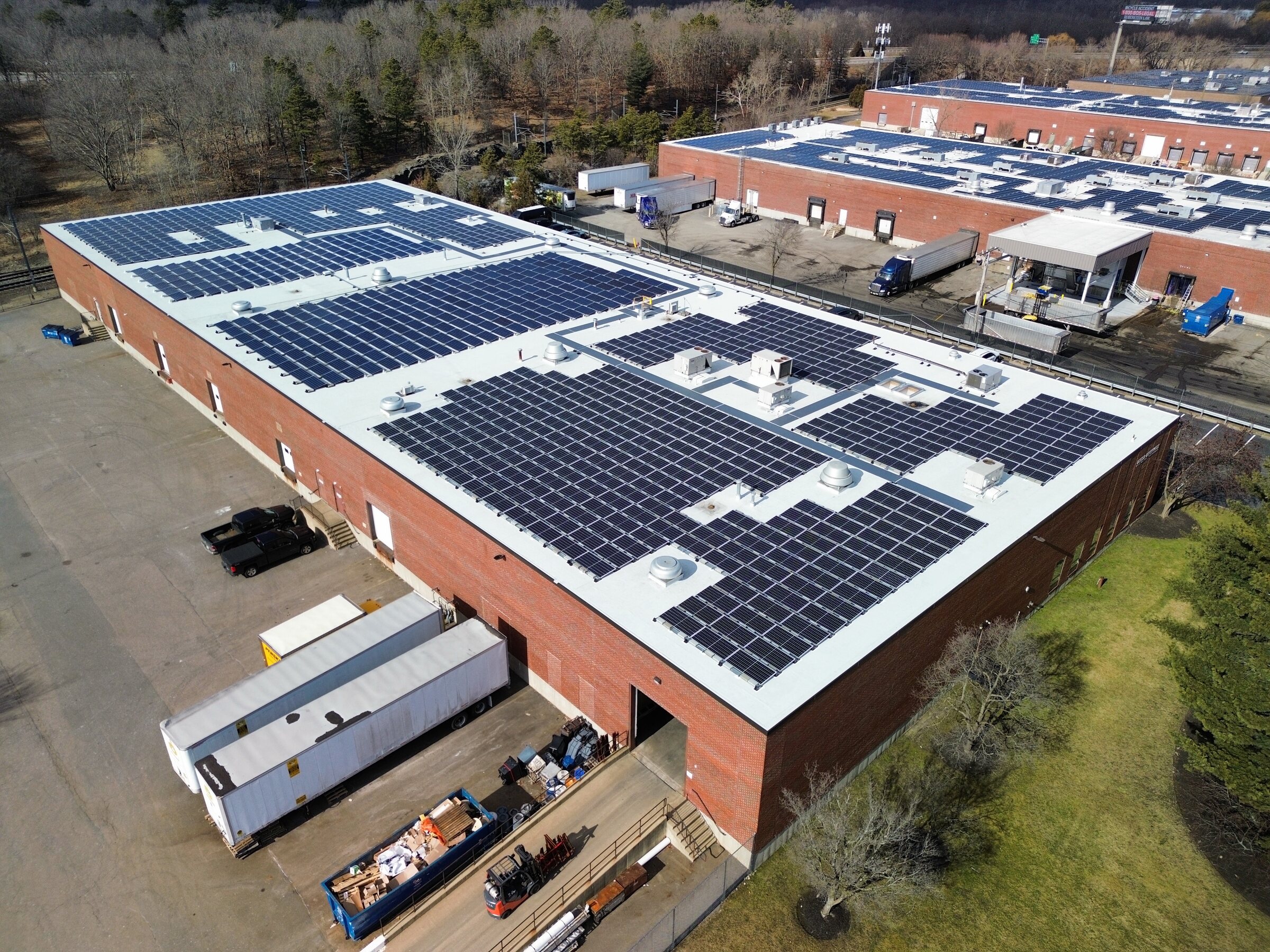 Aerial view of a commercial roof with a reinstalled solar array in Canton, Massachusetts