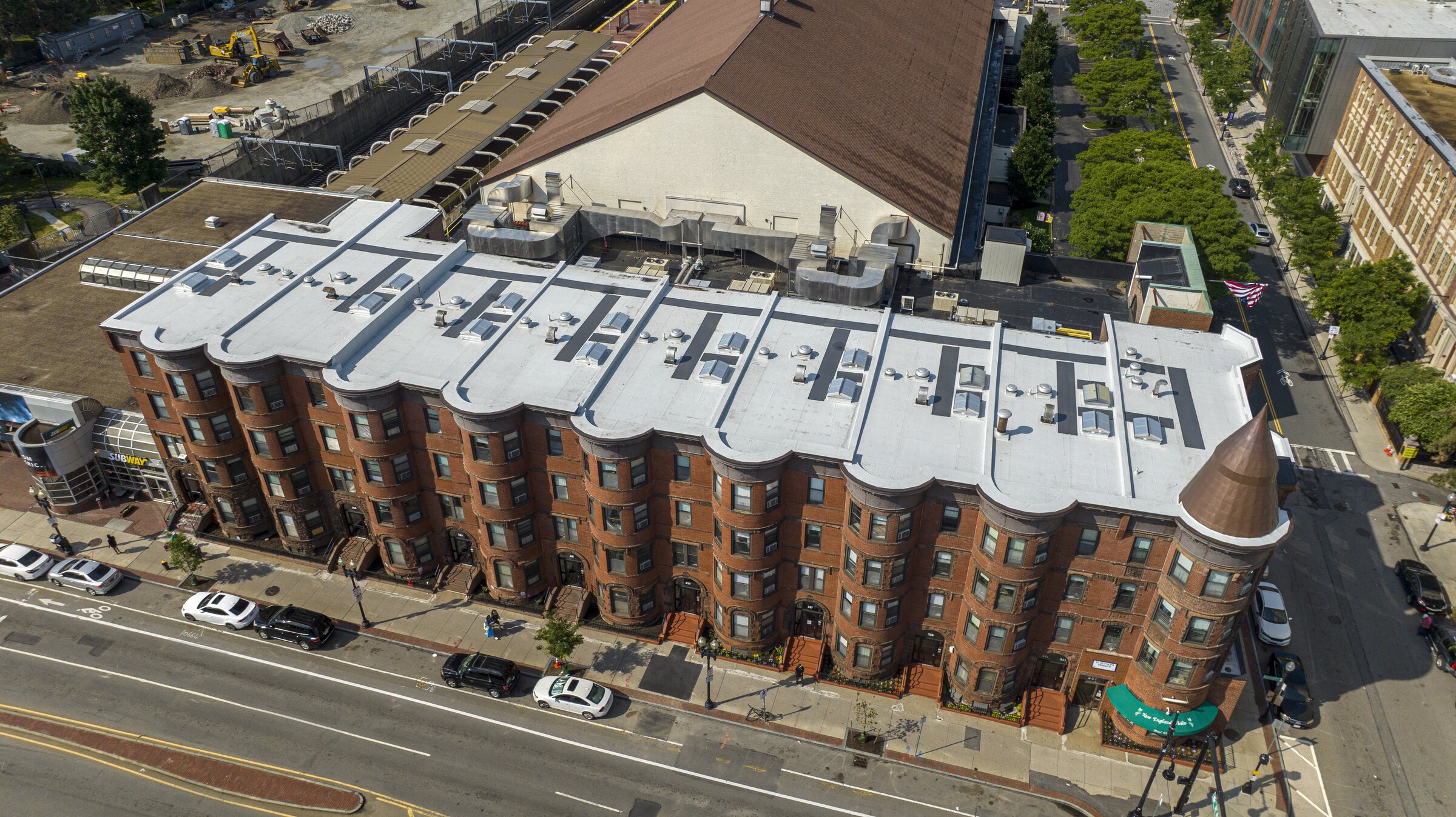 Aerial view of the nine-building residential row at 351–367 Massachusetts Avenue in Boston